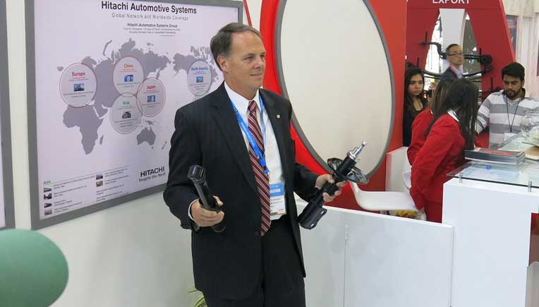 Bradley J. Maggart, President Hitachi Automotive Systems Asia, Ltd. & Executive Officer, Hitachi Automotive Systems, Ltd. at the Hitachi Automotive Systems booth