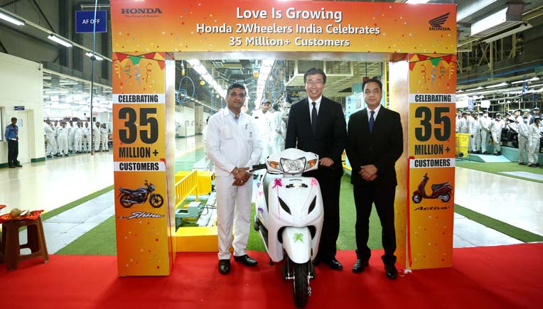 HMSI officials at the company plant