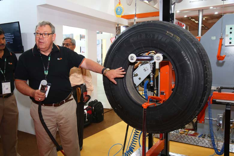 An Elgi official demonstrating new technology at the Tyrexpo 2016 in New Delhi; Pic for representation purpose only