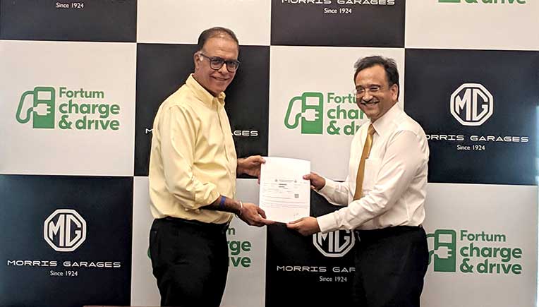 Rajeev Chaba, President & Managing Director, MG Motor India and Sanjay Aggarwal, Managing Director, Fortum India