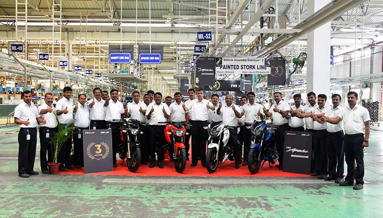 TVS plant workers and officials celebrating