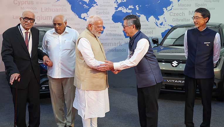 PM commemorates e-Vitara prodn, exports from Maruti Suzuki Gujarat plant 