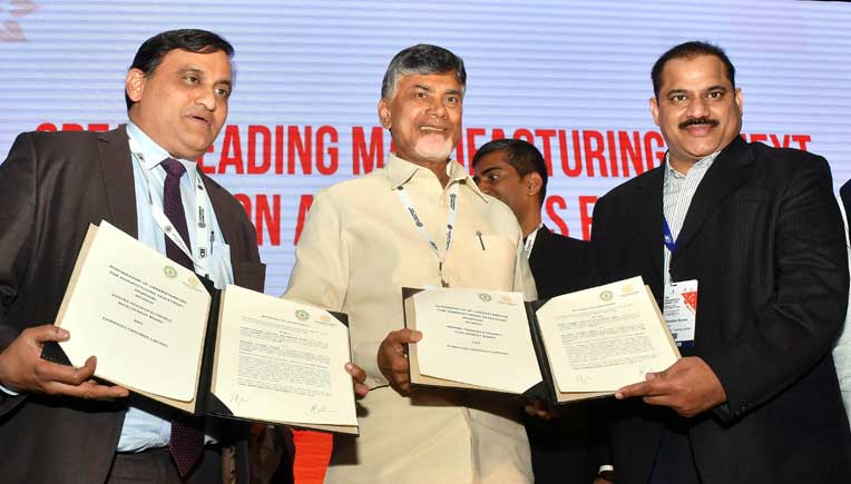 J Krishna Kishore, CEO, AP Economic Development Board, AP Chief Minister N Chandrababu Naidu and Shekhar Movva, President, Synergies Castings Limited exchanging the MoU.