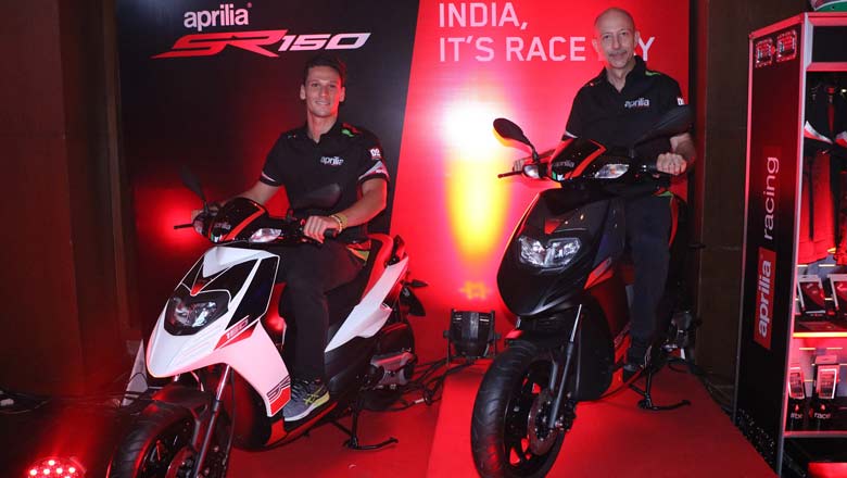 (L to R)) Lorenzo Savadori, 2015 World Champion of Superstock bike racing along with Stefano Pelle, Managing Director and CEO – PVPL at the launch of SR 150 in Mumbai