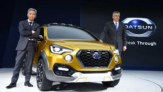 Koji Nagano, Executive Design Director (L),  Datsun along with Vincent Cobee, Corporate Head of Datsun poses with the Datsun GO-Cross Concept at the Delhi Auto Expo 2016