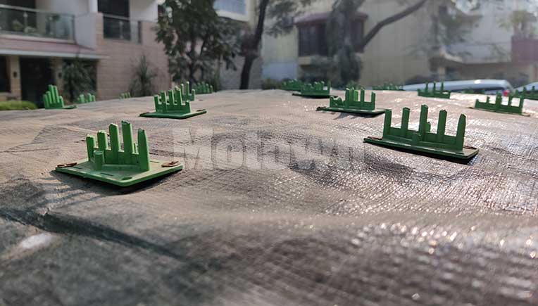 The car roof cover with the spikes trimmed