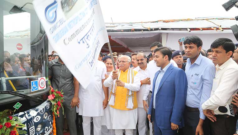 Haryana CM flagging off the new bus service in Gurugram