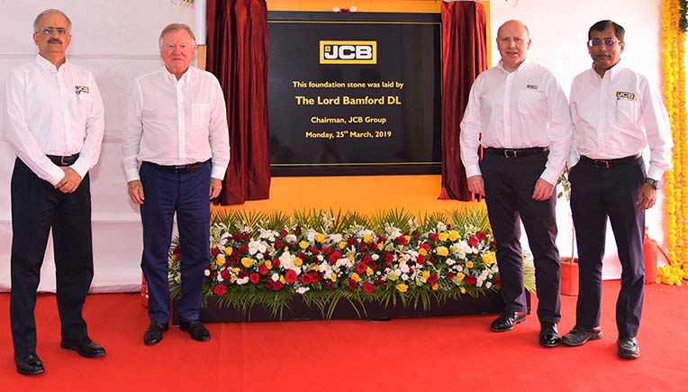 JCB officials while making announcement on investments
