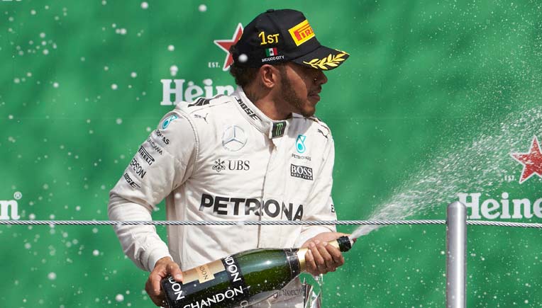 Hamilton celebrates ; Picture courtesy Daimler